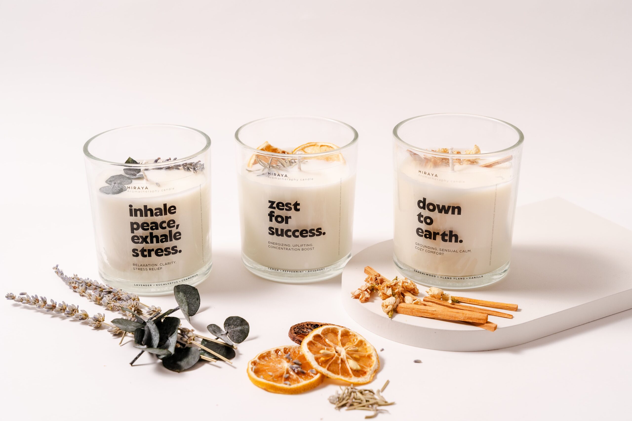 Front view of three aromatherapy soy candles featuring lavender eucalyptus chamomile, lemon peppermint rosemary, and sandalwood ylang‑ylang vanilla blends