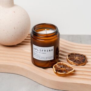 Top view of the Uplifting candle with smooth wax and centered wick.