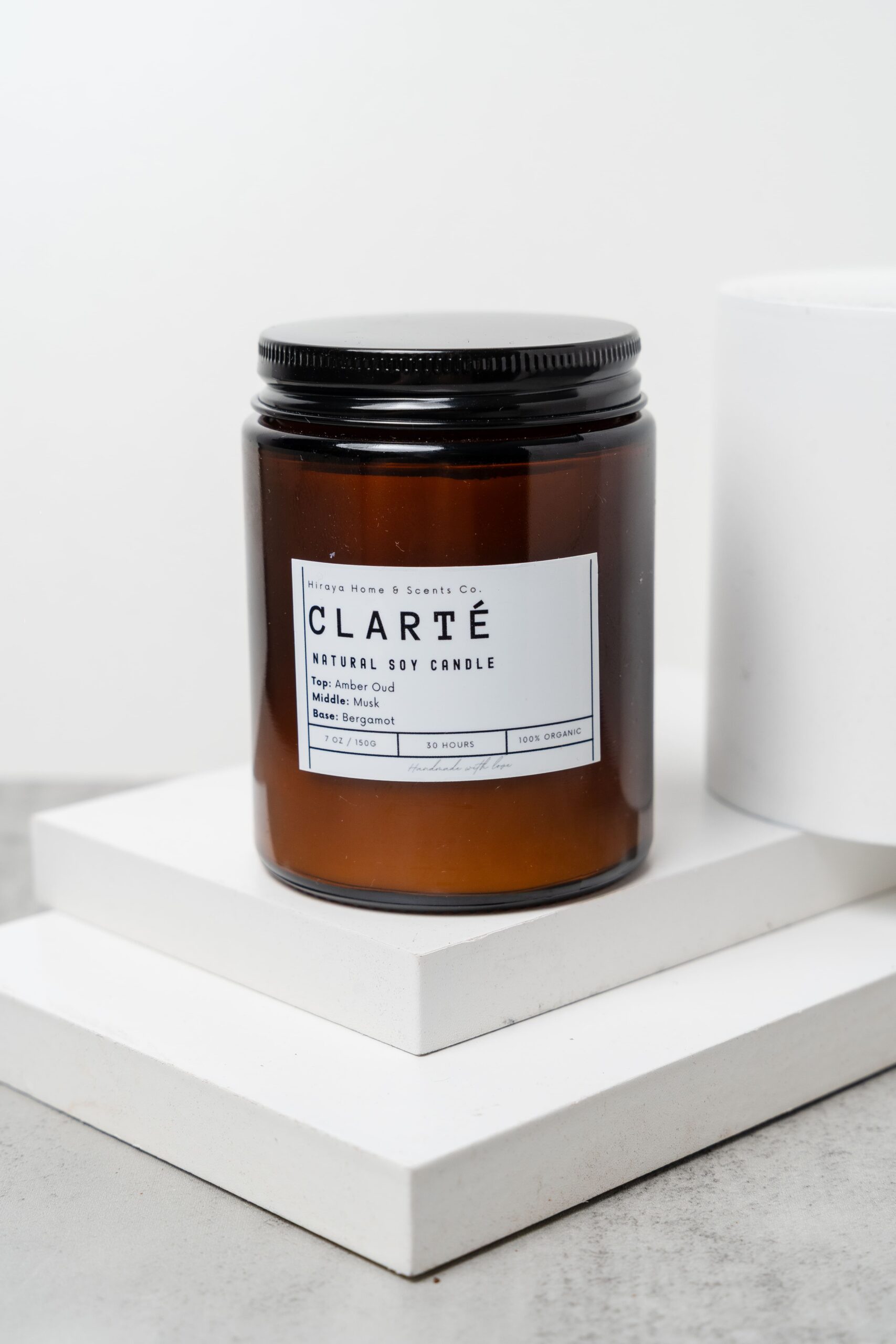 Close‑up showing wax texture and fresh bergamot‑inspired label details.