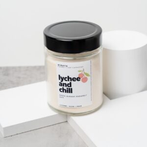 Front view of the Lychee and Chill candle with its soft, elegant lychee‑rose label in a 280ml jar.
