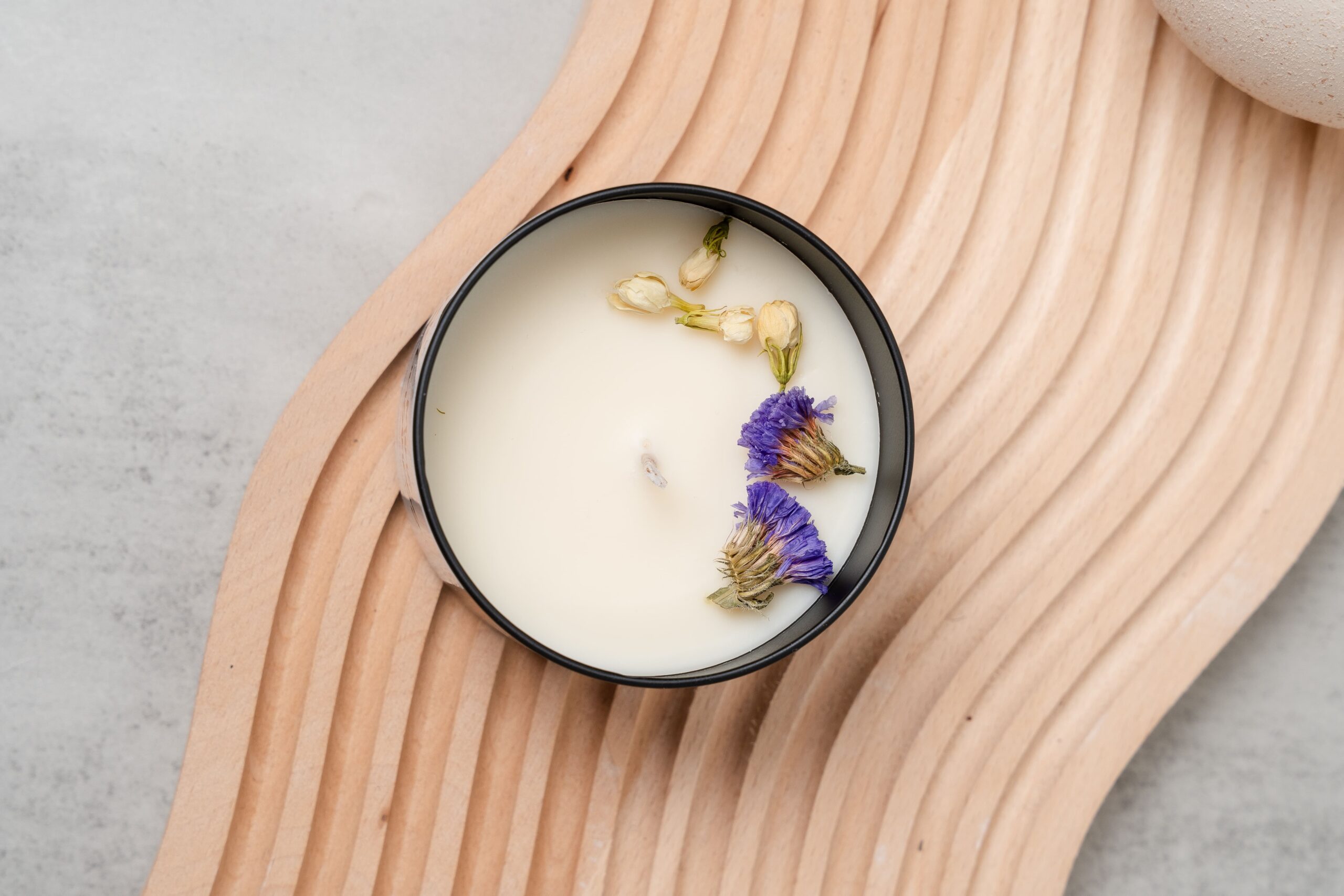 Top view of the Jas‑Mine Your Business candle with smooth wax and centered wick in a 220ml jar.