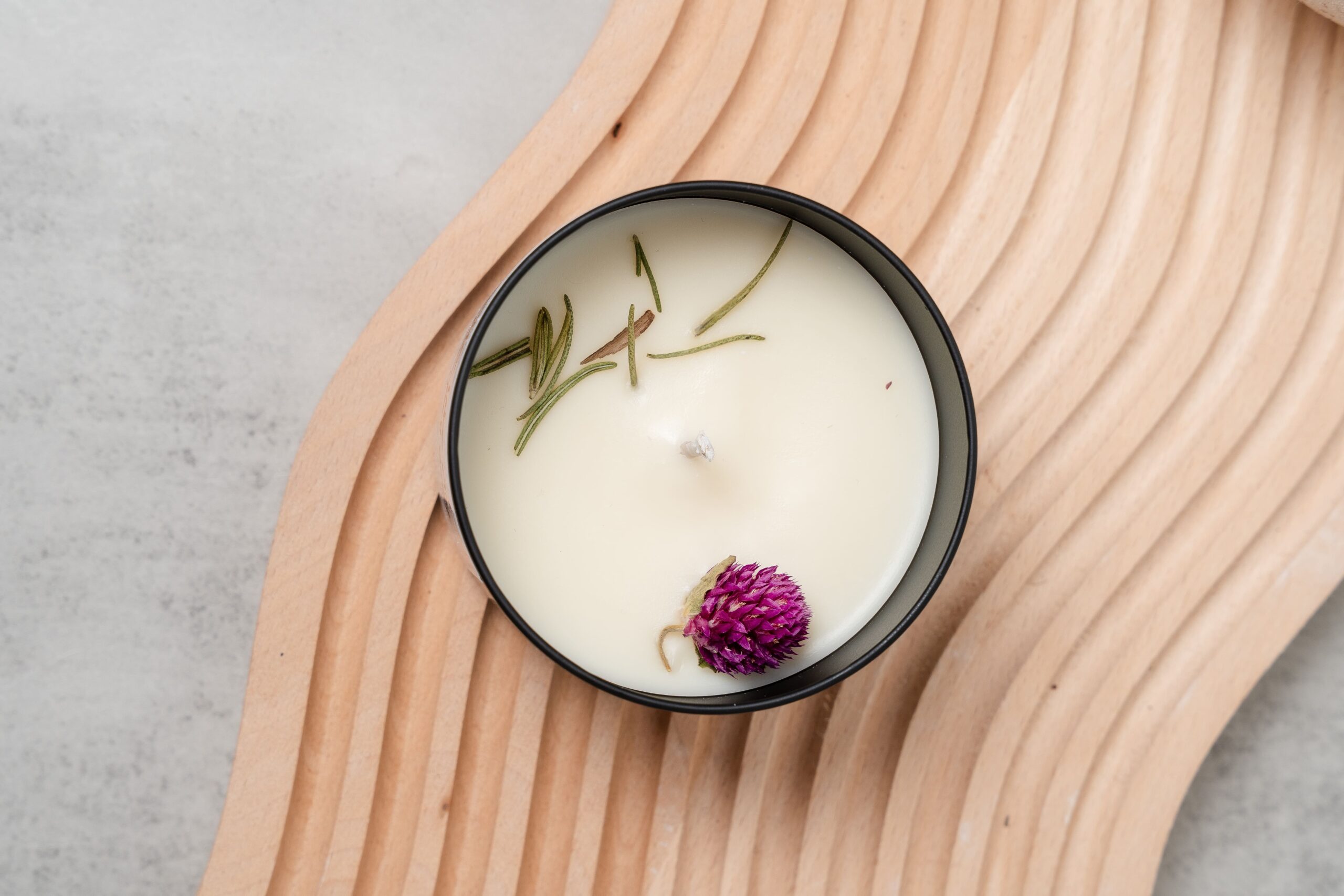 Top view of the Smells Like New Beginning candle with smooth wax and centered wick in a 220ml jar.