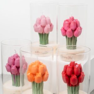 Front display of the Blushing Lotus “Serene Affection” candles in five colors — orange, red, pink, purple, and fuchsia pink — arranged together as a lotus bouquet.
