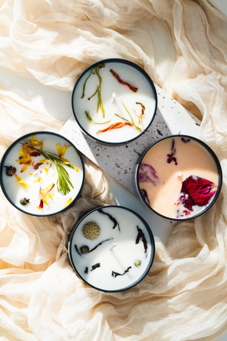 Top shot of all four Floral Collection candles showing floral label artwork and cohesive design