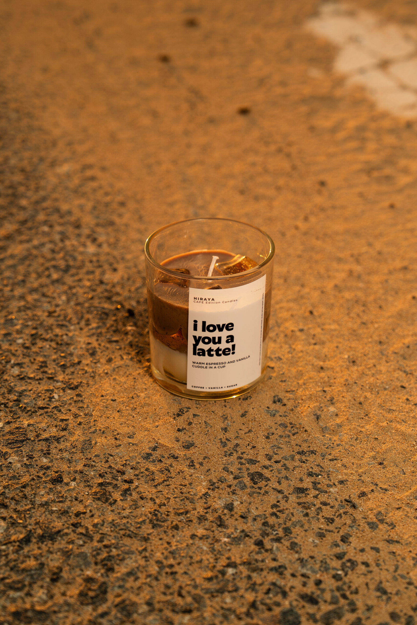 Lifestyle image of I Love You a Latte candle styled in desert shot