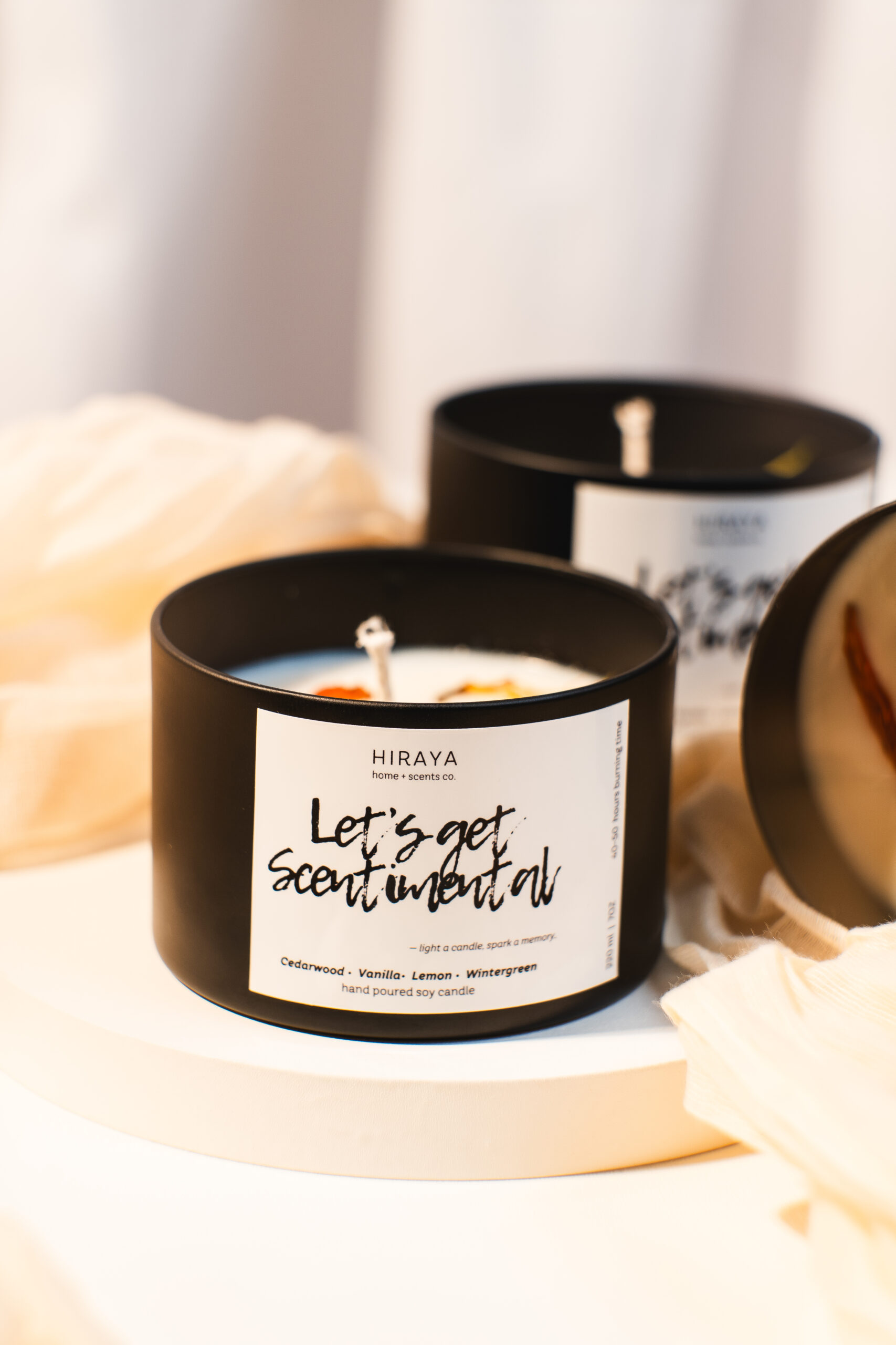 Close‑up of soy candle label showing Cedarwood, Vanilla, Lemon and Wintergreen scent blend
