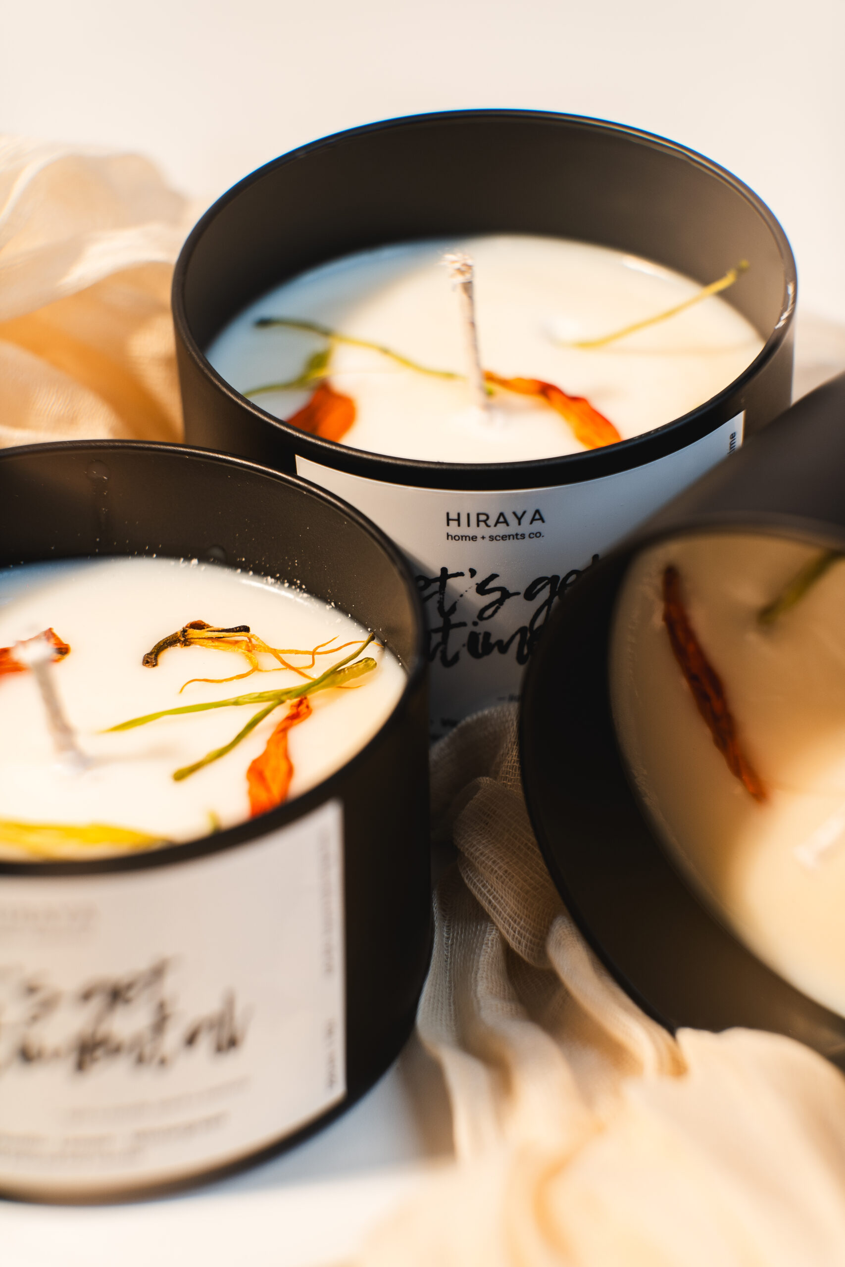 Close up of soy candle showing the dried flowers design